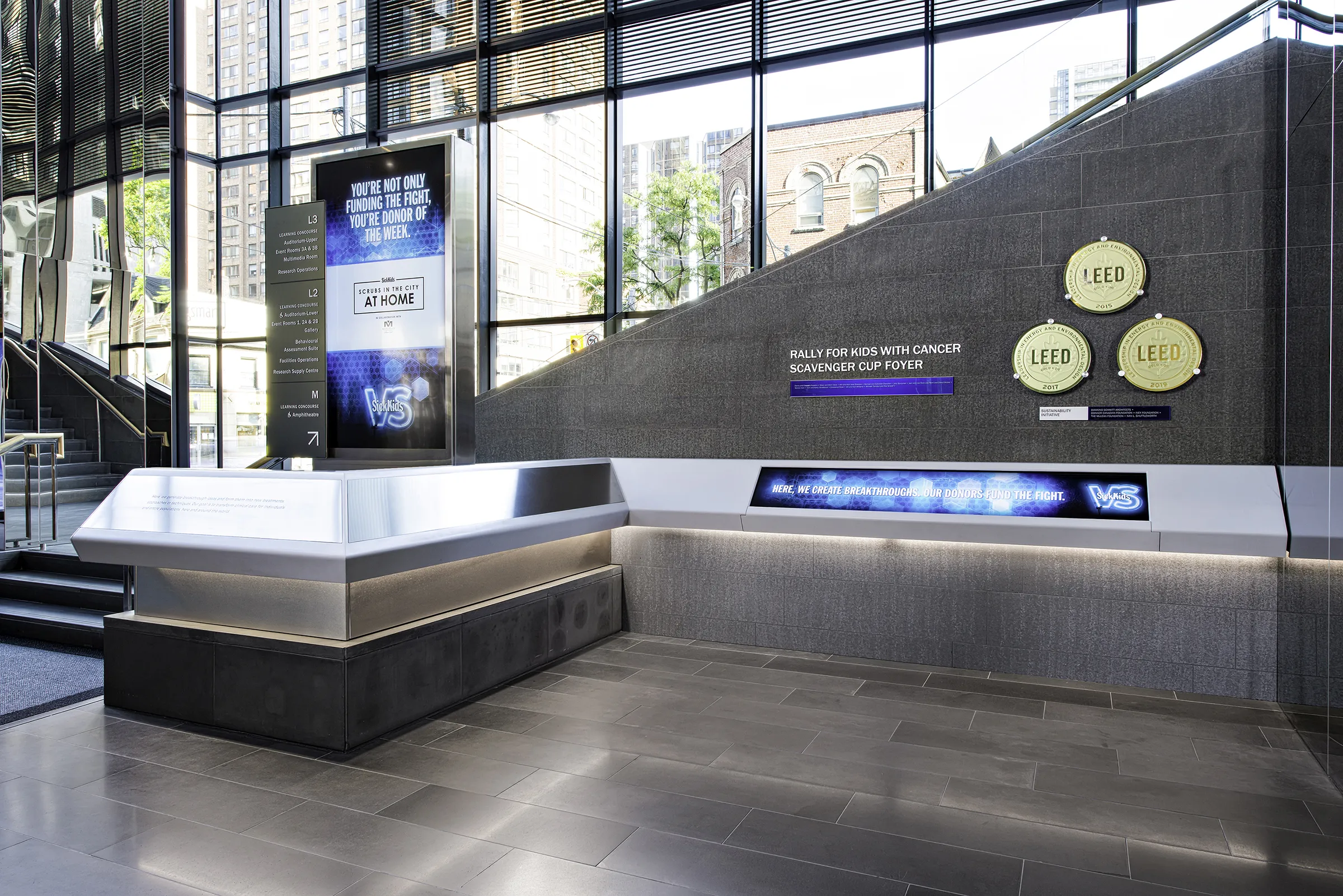 SickKids PGCRL lobby donor recognition wall and interactive counter